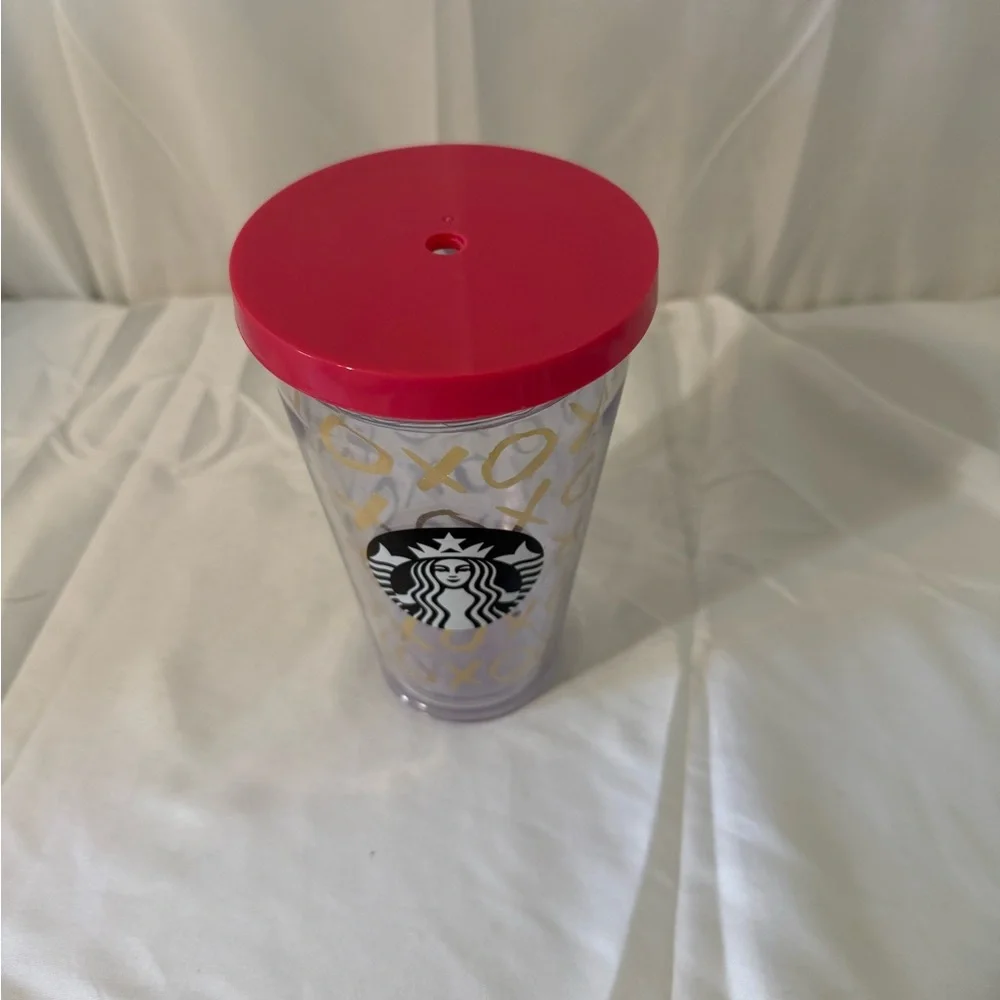 Starbucks Clear Tumbler with Pink Lid and Gold XO Pattern. No straw.